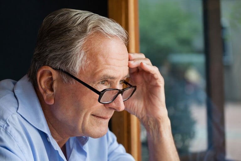 Close up of senior sitting at table