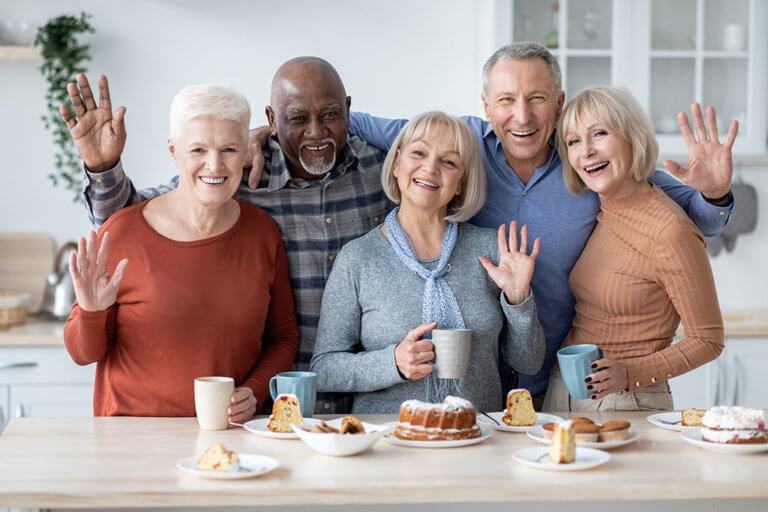 Portrait of cheerful elderly men and women spending time together