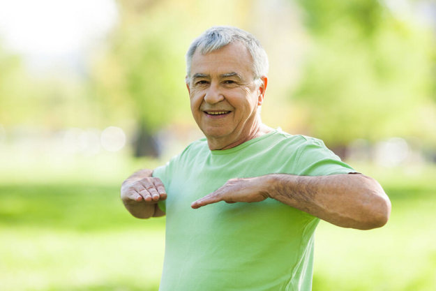 Senior man is exercising in park. Active retirement Senior man is exercising in park. Active retirement
