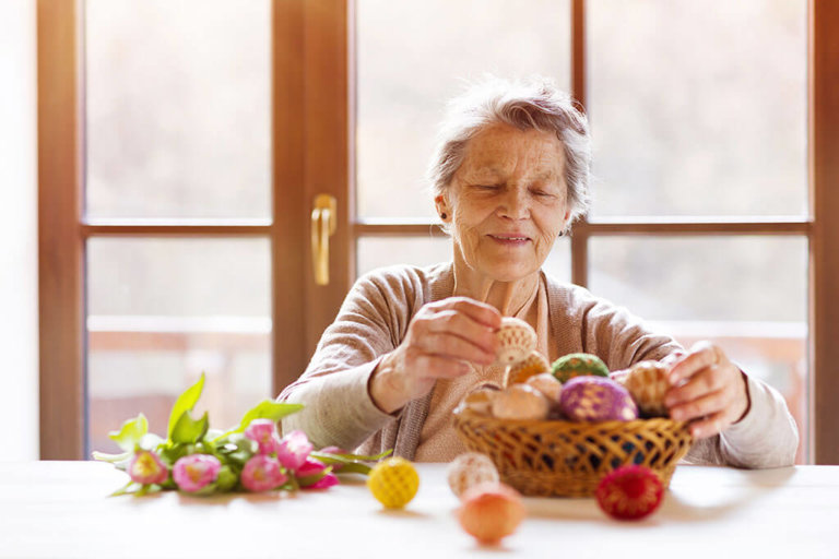 Senior woman with easter eggs