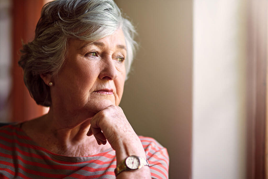 She has a lot on her mind. Shot of a senior woman looking thoughtful