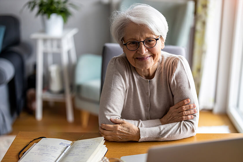 Portrait of smiling senior woman at home