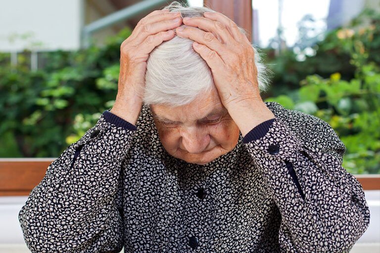 Unhappy elderly woman