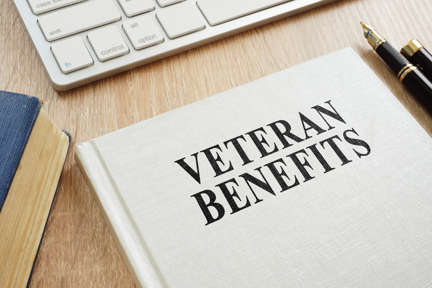 Book about Veteran Benefits on a desk. Veteran Benefits For Assisted Living: 4 Things You Should Know