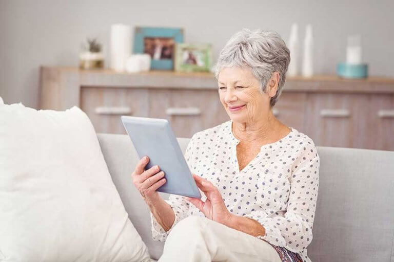 Senior woman using digital tablet