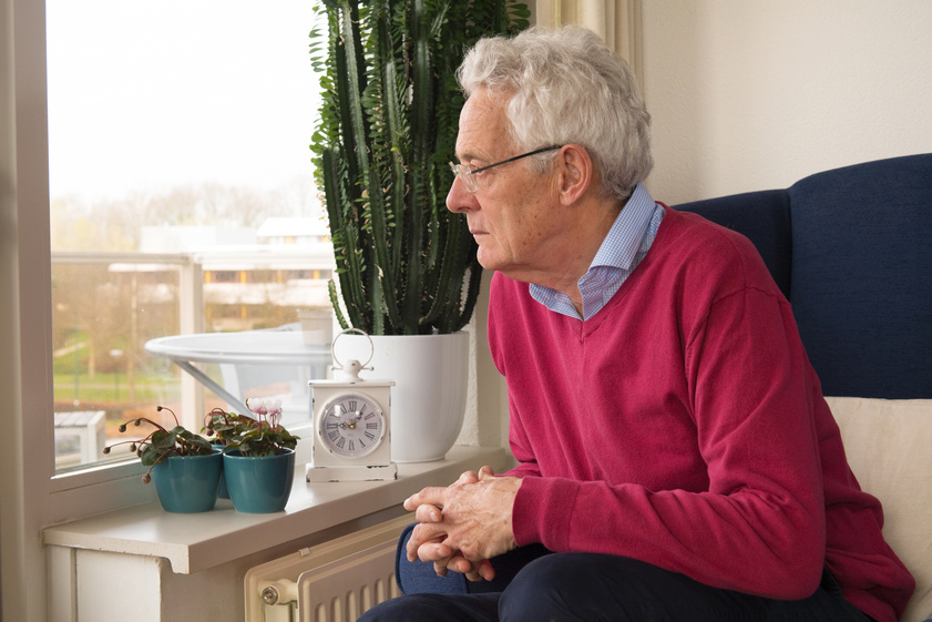 Senior man alone in interior