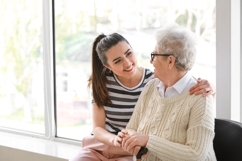Caregiver with senior woman in nursing home Caregiver with senior woman in nursing home