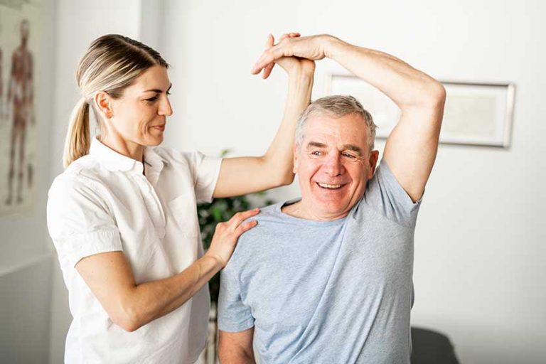 A Modern rehabilitation physiotherapy worker with senior client