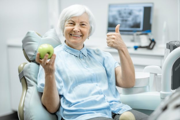Portrait of a senior woman at the dental office The Importance Of Oral Care For Your Loved One