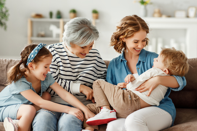 Multi generational relatives having fun on sofa Multi generational relatives having fun on sofa