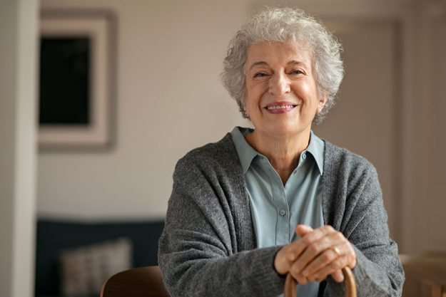 Old happy grandmother looking at camera