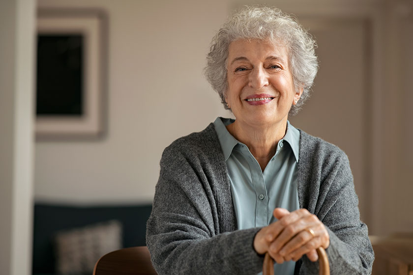Old happy grandmother looking at camera