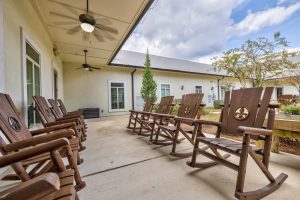 A row of chairs provided for senior living residents in the garden behind SummerHouse Bay Cove apartments