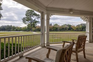 Two chairs available for seniors on the patio of SummerHouse Bay Cove apartments' garden