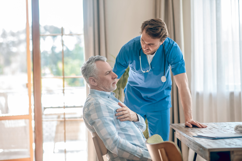 Physician taking care of a diseased middle-aged patient Physician taking care of a diseased middle-aged patient