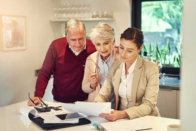 Shot of a senior couple getting advice from their financial consultant
