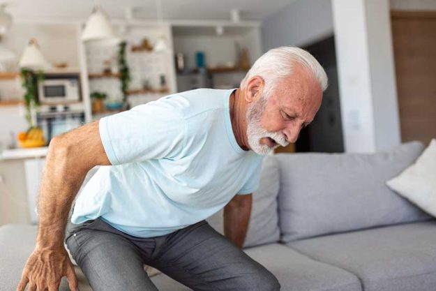 Senior elderly man touching his back, suffering from backpain Senior elderly man touching his back, suffering from backpain