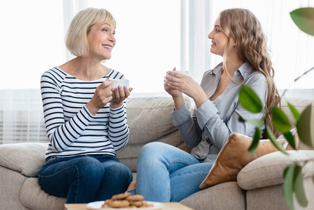Happy senior mother and grown daughter laughing Happy senior mother and grown daughter laughing