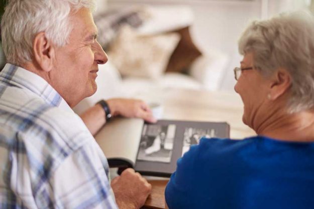 Senior couple reminiscing good old times