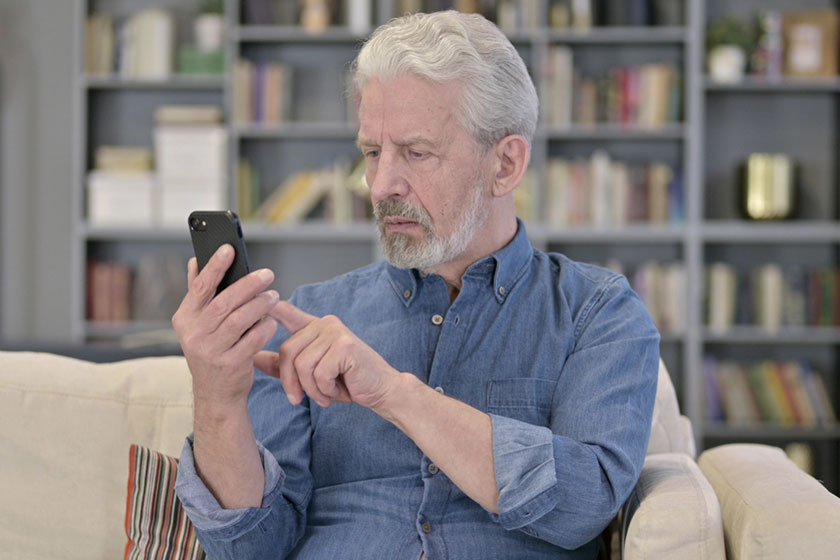 Senior man using smartphone