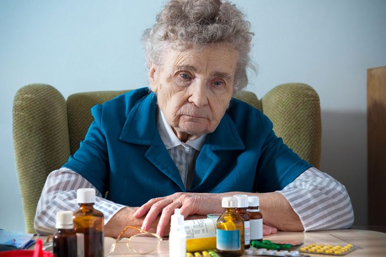 senior woman with her medicine