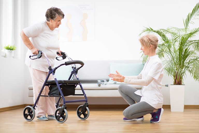 Senior woman with walker trying to walk again