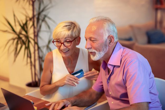 Senior couple shopping online