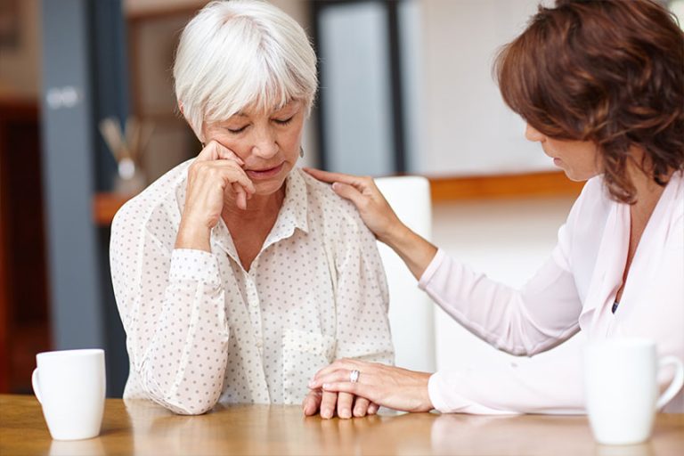 Shot of a woman supporting her elderly mother through a difficult time.