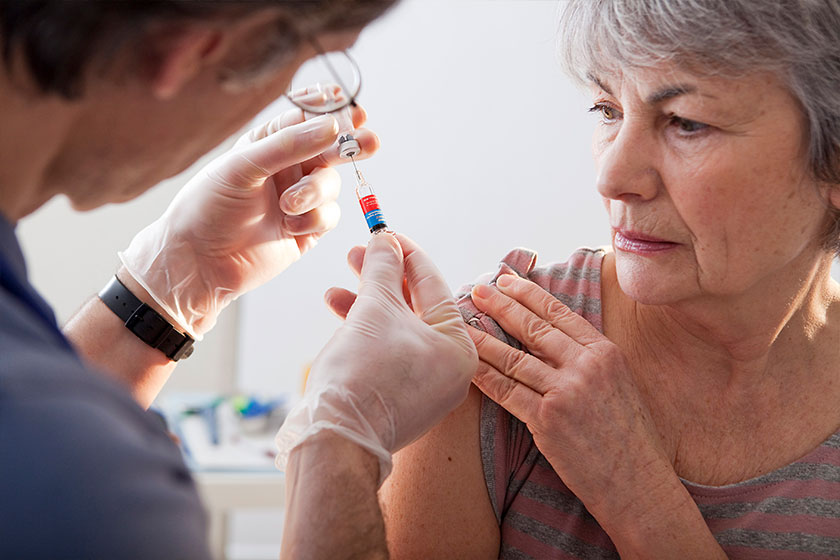 VACCINATING AN ELDERLY PERSON