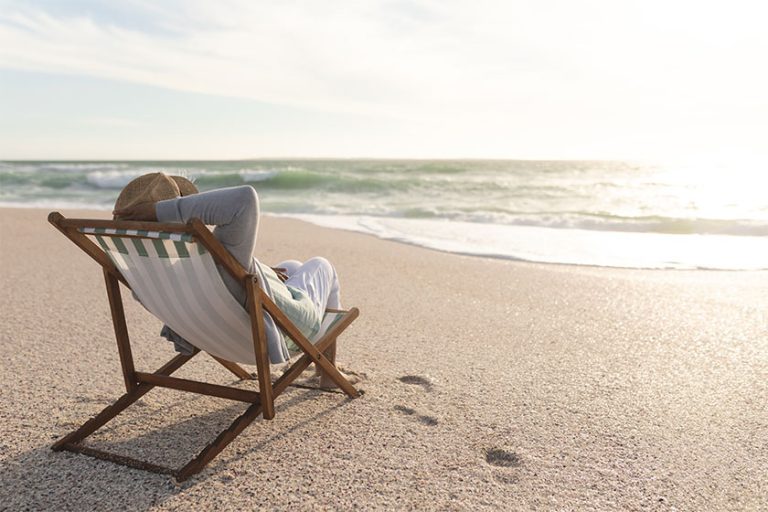 Relaxed Retired Senior Biracial Woman Sitting Folding Chair Enjoying Sunset