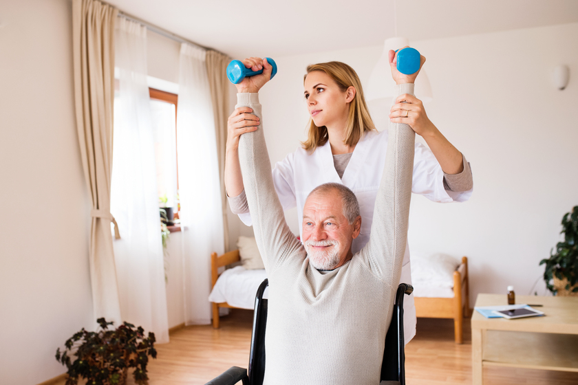 Nurse and senior man in wheelchair during home visit. 16 Ways Assisted Living in Madison, MS Makes Exercising Much Safer for Older Adults with Wheelchairs