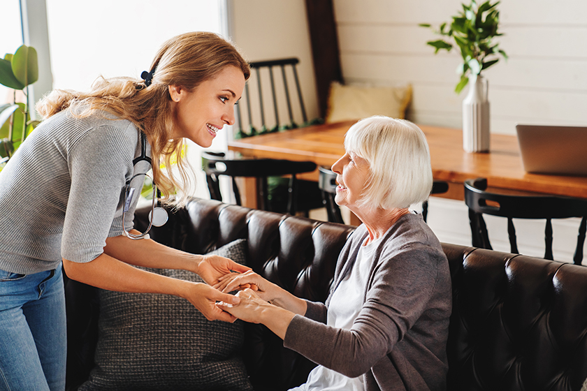 Care of senior woman by caretaker at home Care of senior woman by caretaker at home