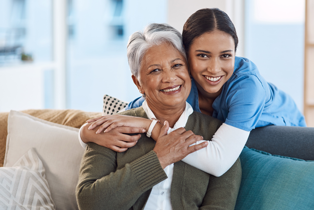 Smile, portrait and nurse hugging old woman