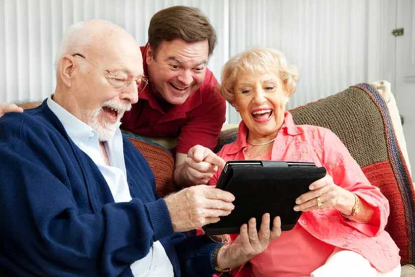 Family Uses Tablet PC and Laughs