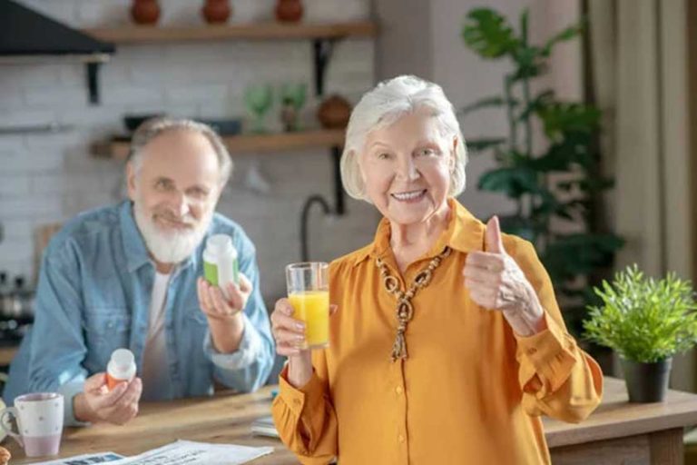 Happy elderly couple having a healthy breakfast
