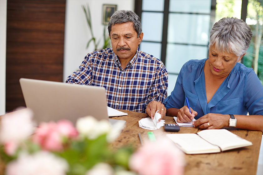 Focused on their finances. a senior couple working .
