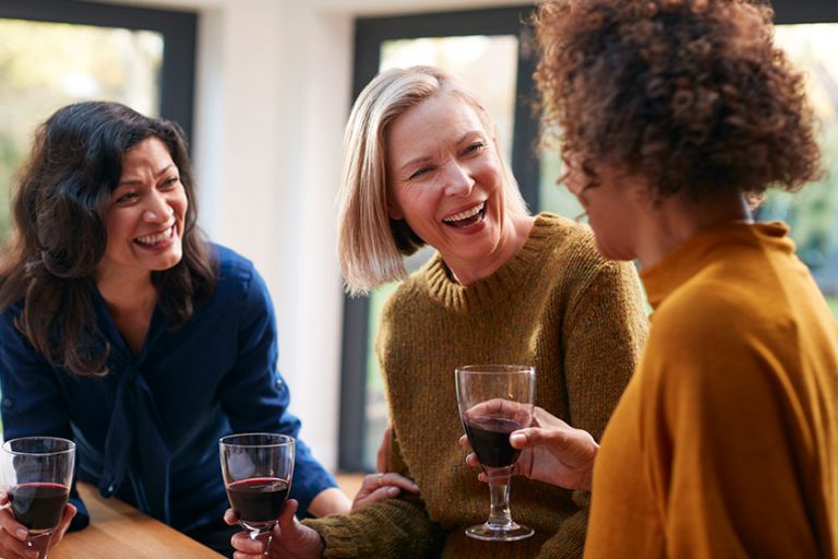 Group Of Mature Female Friends Meeting At Home
