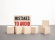 MISTAKES TO AVOID words on wooden blocks