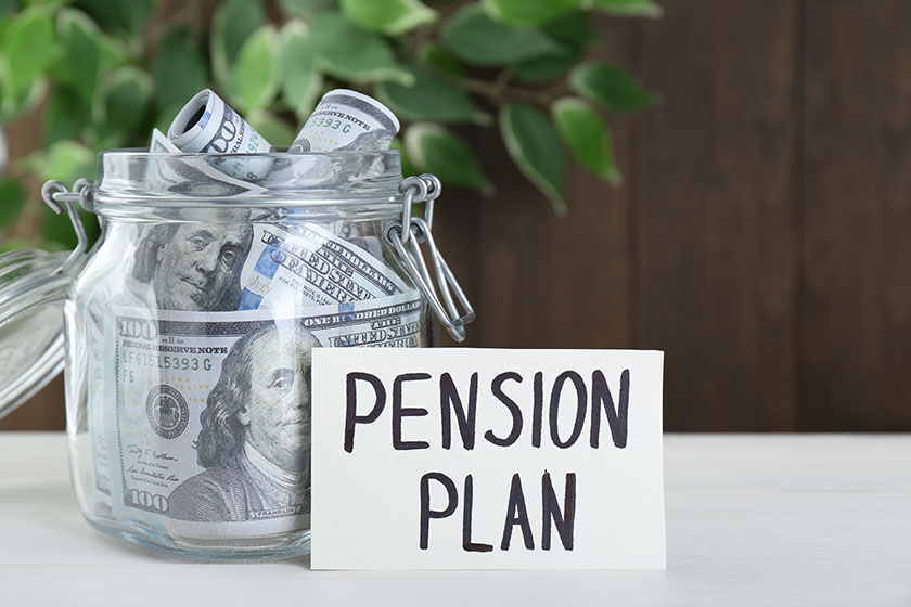 card phrase pension plan dollar banknotes glass jar white wooden