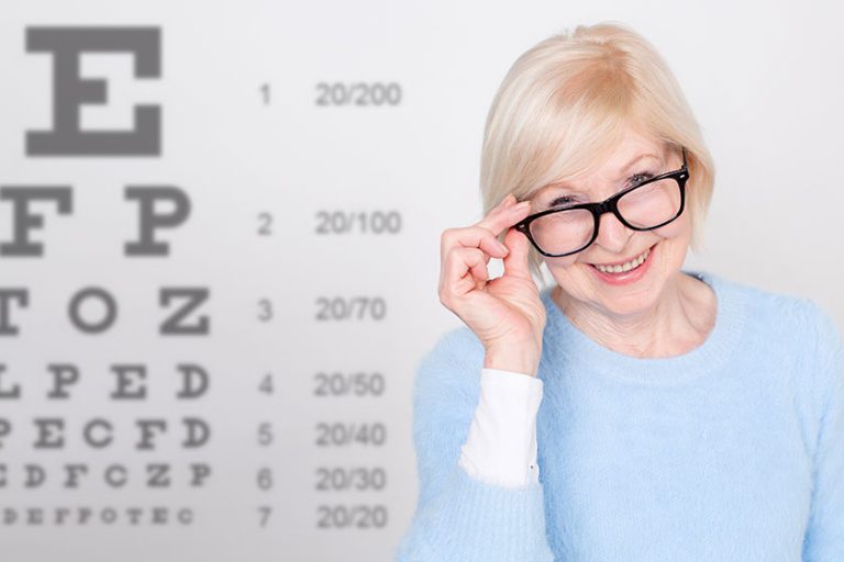 senior woman glasses having eye vision testing tables background visiting