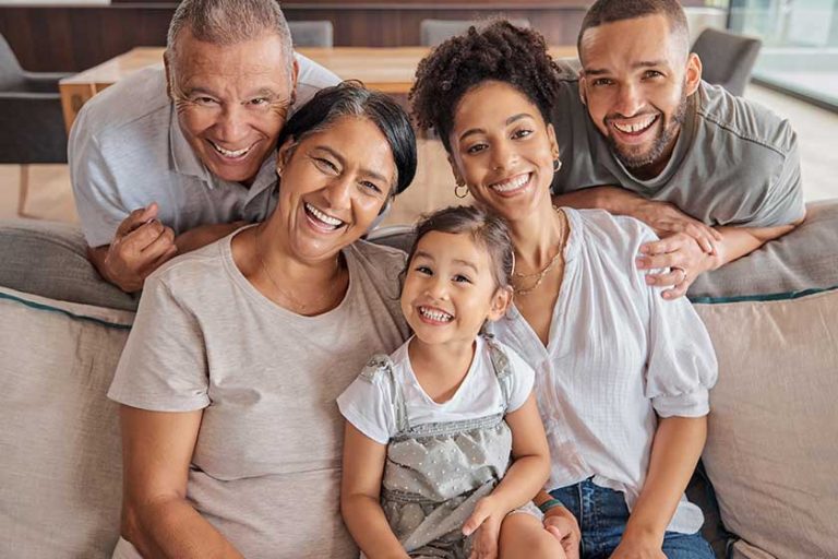 happy family couple grandparents child sofa living room happy love