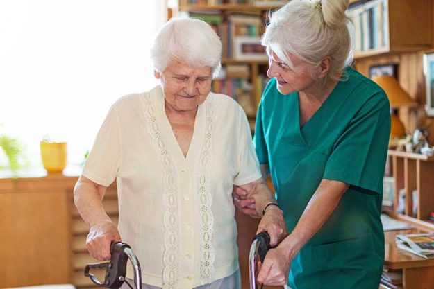 senior woman her female caregiver