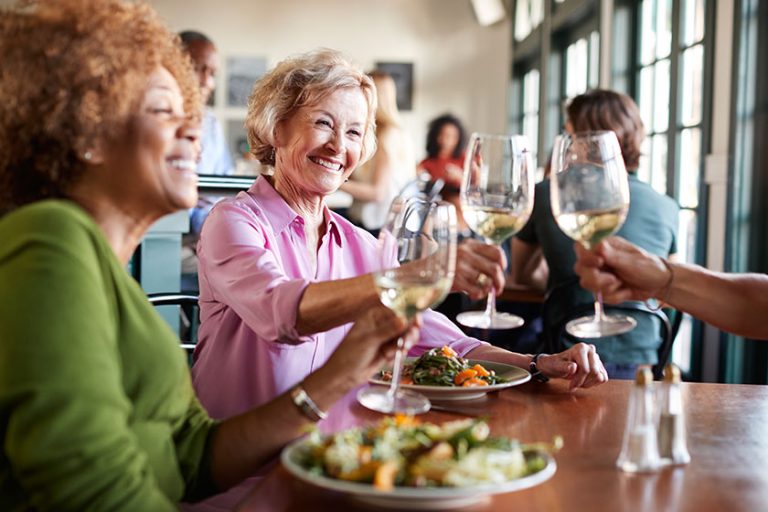 smiling senior women making toast meal restaurant