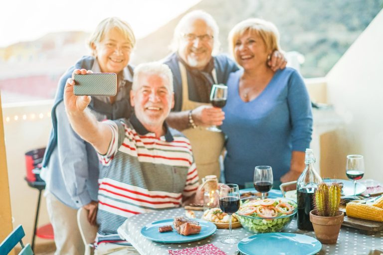 Happy,Seniors,Friends,Taking,A,Selfie,Photo,With,Smartphone,Camera