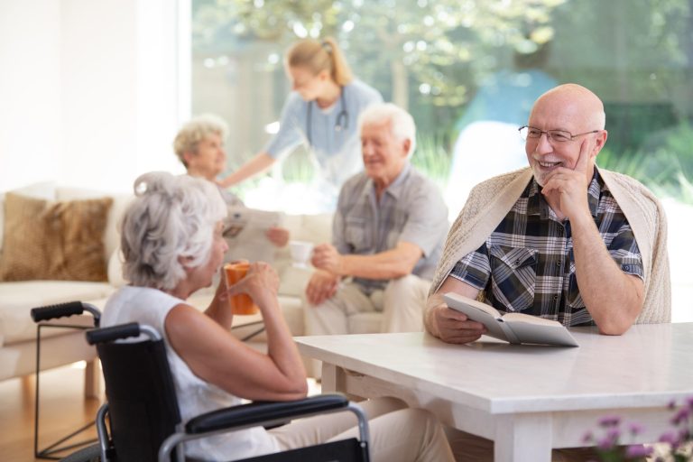Elderly,Woman,In,The,Wheelchair,Drinking,Tea,During,Conversation,With