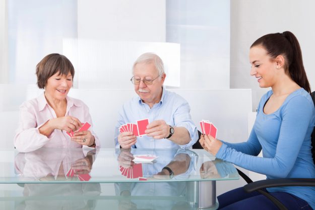 Caretaker Playing Cards With Senior Couple — Photo Caretaker Playing Cards With Senior Couple — Photo