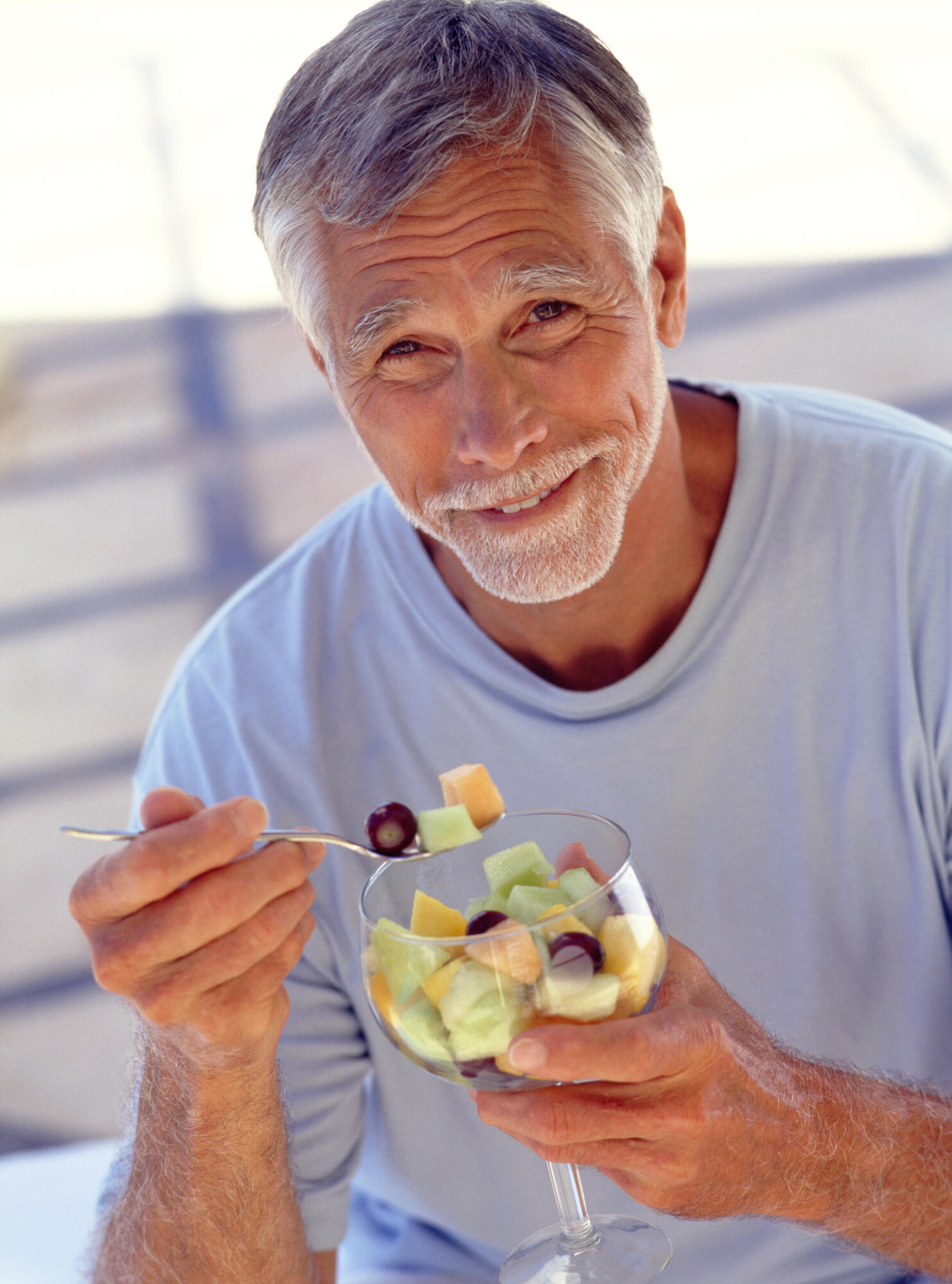Portrait,Of,Mature,Man,Eating,Fruit,Cocktail Portrait,Of,Mature,Man,Eating,Fruit,Cocktail