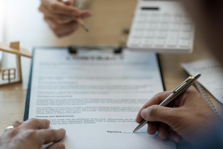 Close up man signing contract