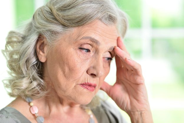 Close up portrait of sad senior woman at home Close up portrait of sad senior woman at home