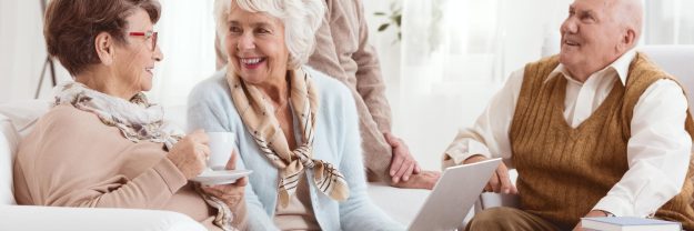 Group,Of,Senior,Friends,Drinking,Tea,And,Chatting,During,A